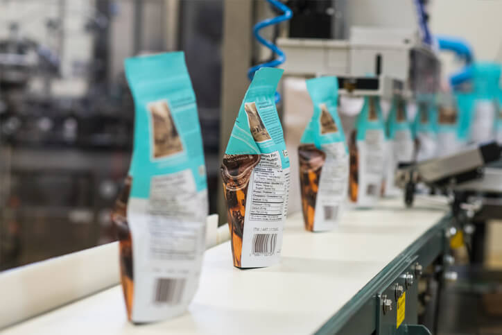 A production line for sealing snack bags.