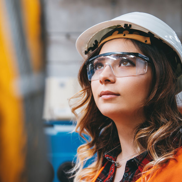 Worker wearing hard hat and safety googles