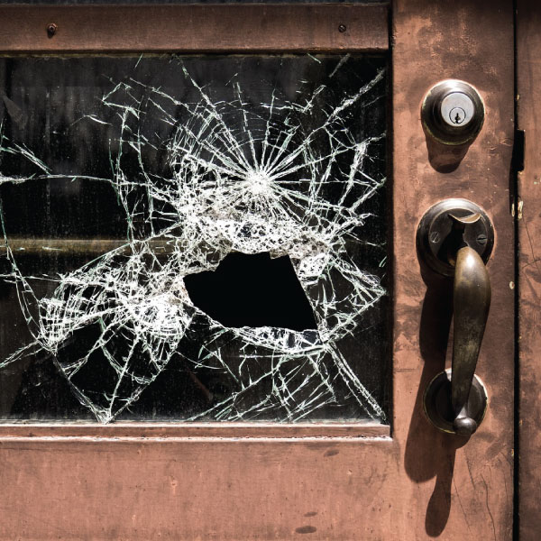 door with broken glass panel